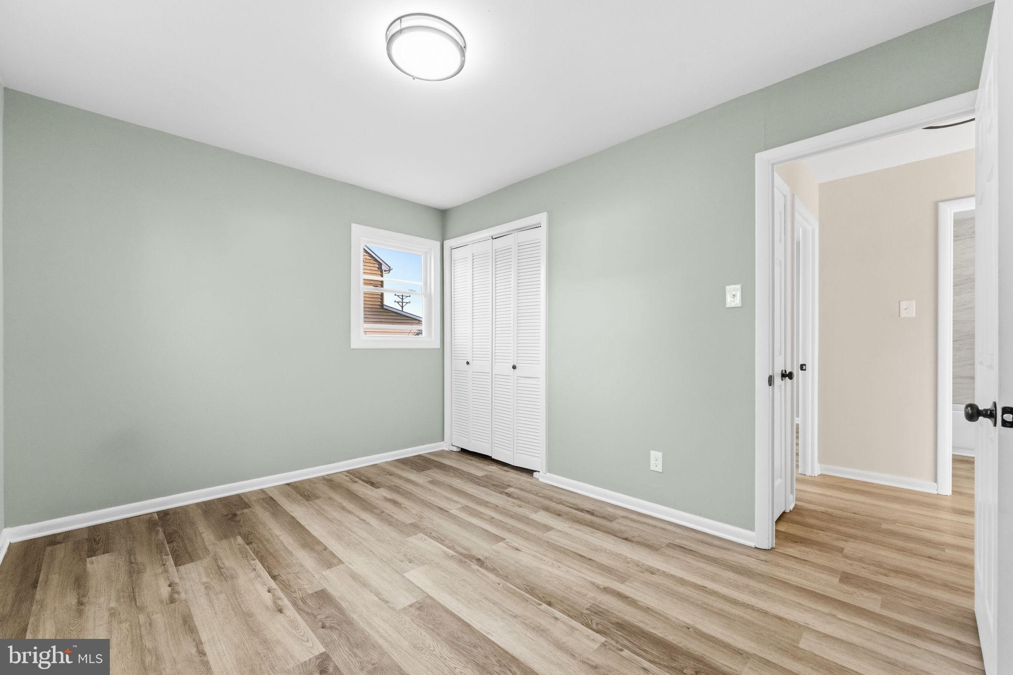819 Old Harmony Road Newark, DE 19711 - Photo 16 of 39 a view of room with wooden floor and window