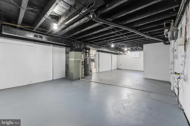 a view of a house with a yard covered in and trees