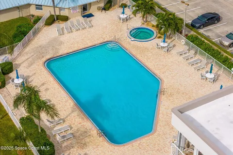 a view of a swimming pool with a yard