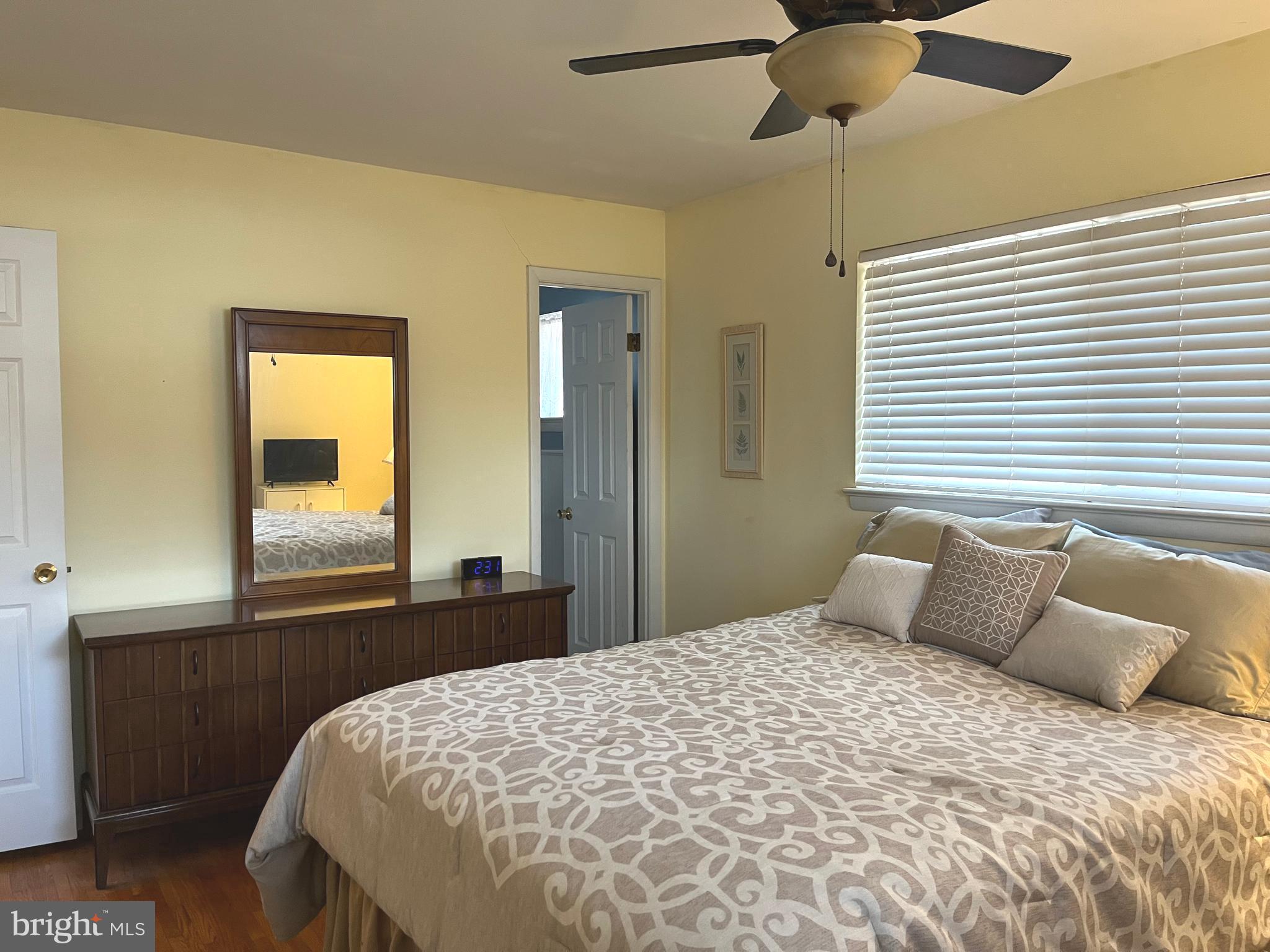 7018 Redmiles Road Laurel, MD 20707 - Photo 13 of 39 a bedroom with a bed and a window