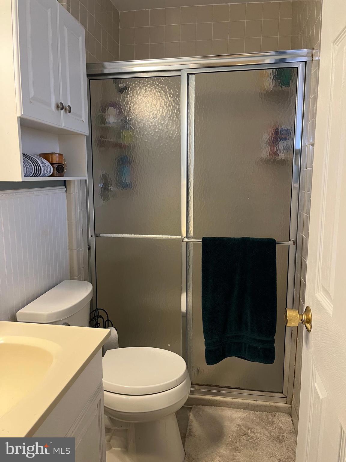 7018 Redmiles Road Laurel, MD 20707 - Photo 15 of 39 a bathroom with a toilet and a shower