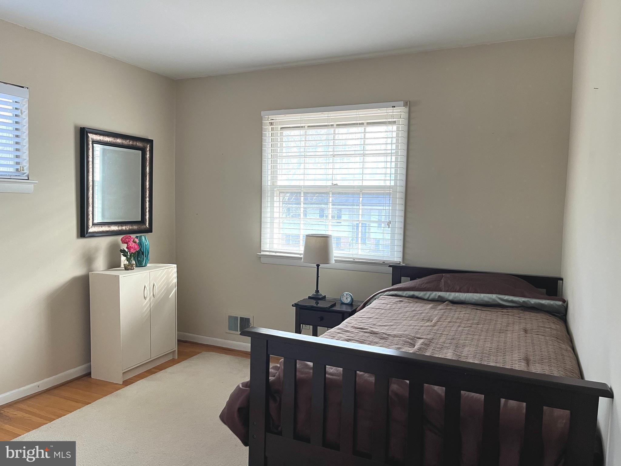 7018 Redmiles Road Laurel, MD 20707 - Photo 16 of 39 a bedroom with a bed and a window