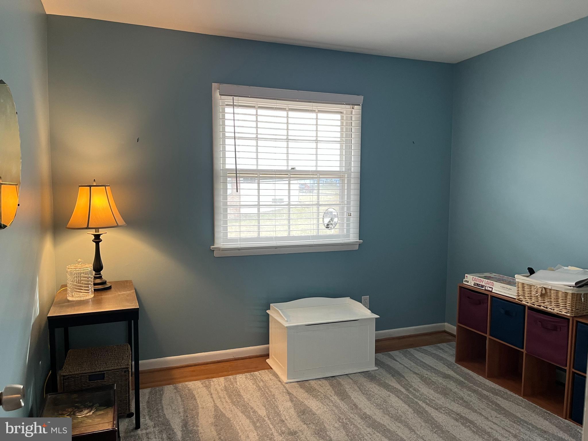 7018 Redmiles Road Laurel, MD 20707 - Photo 19 of 39 a bedroom with a bed and a lamp