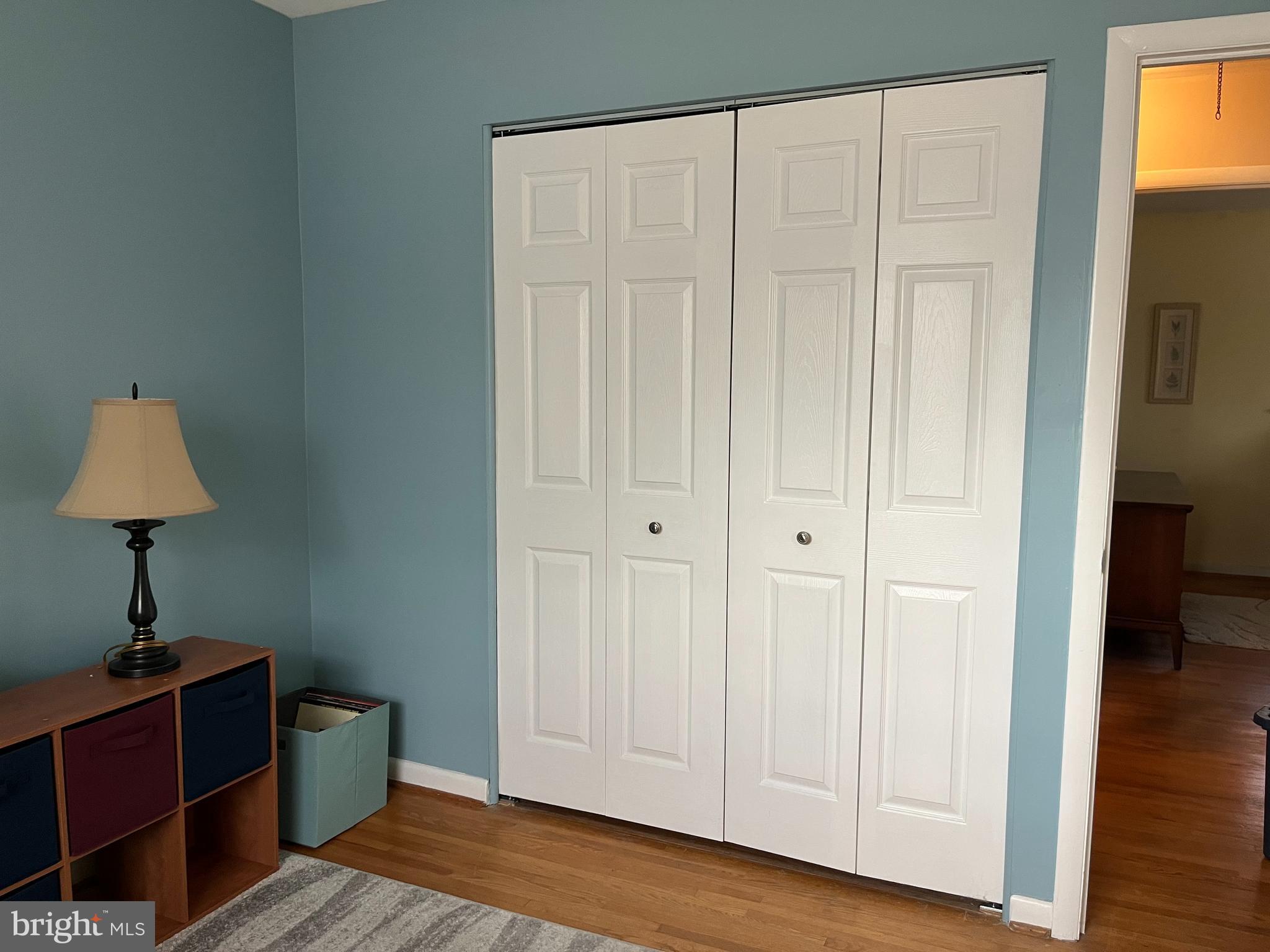 7018 Redmiles Road Laurel, MD 20707 - Photo 20 of 39 a view of a room with wooden floor cabinet and a table