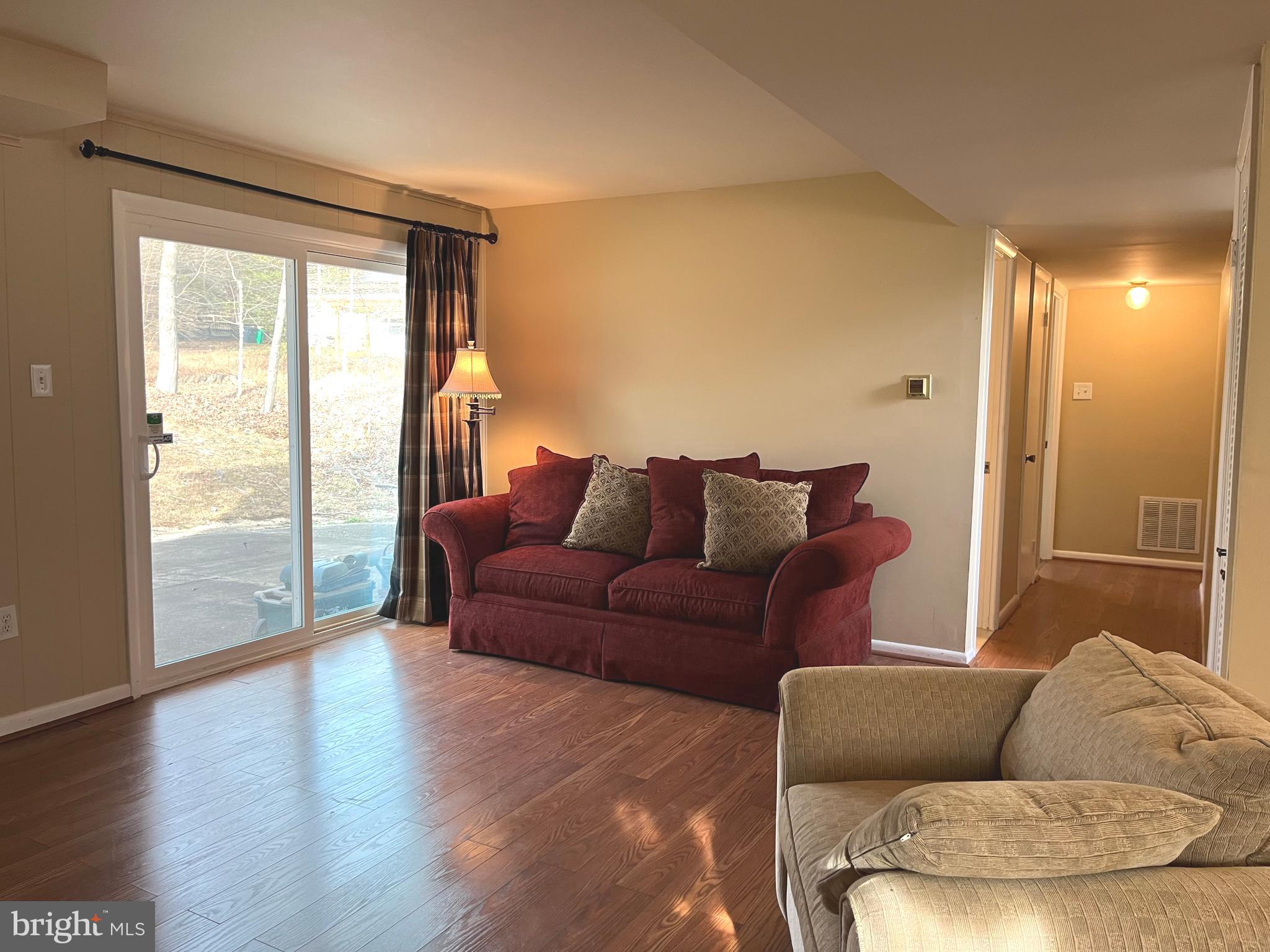 7018 Redmiles Road Laurel, MD 20707 - Photo 27 of 39 a living room with furniture and a large window
