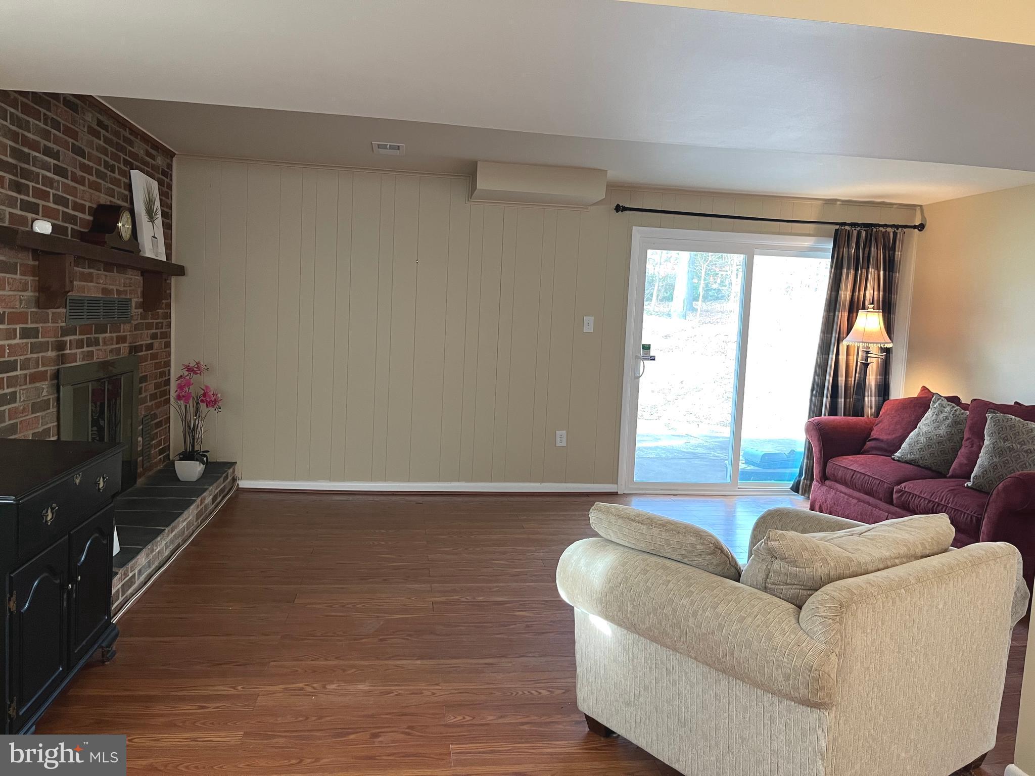 7018 Redmiles Road Laurel, MD 20707 - Photo 28 of 39 a living room with furniture and a flat screen tv