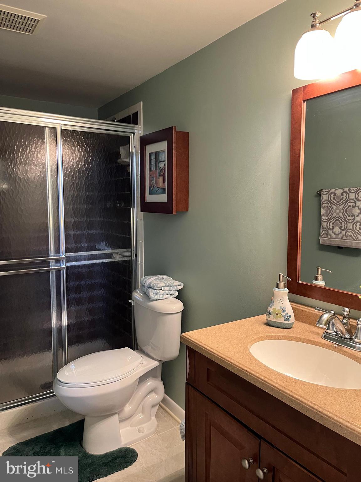 7018 Redmiles Road Laurel, MD 20707 - Photo 33 of 39 a bathroom with a sink toilet and shower