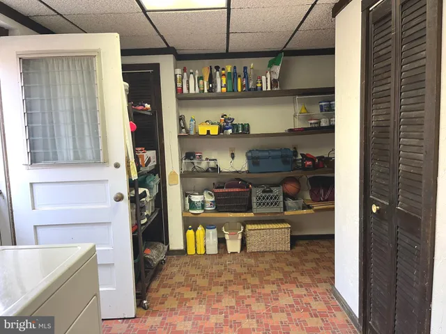 a kitchen with stainless steel appliances granite countertop a sink and a refrigerator