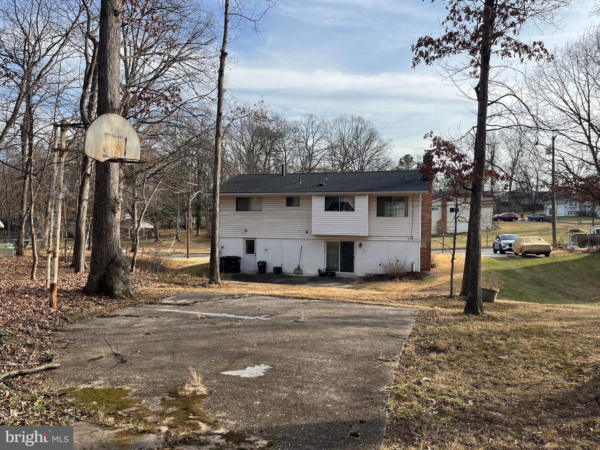 7018 Redmiles Road Laurel, MD 20707 - Photo 37 of 39 a view of a house with a yard covered in snow