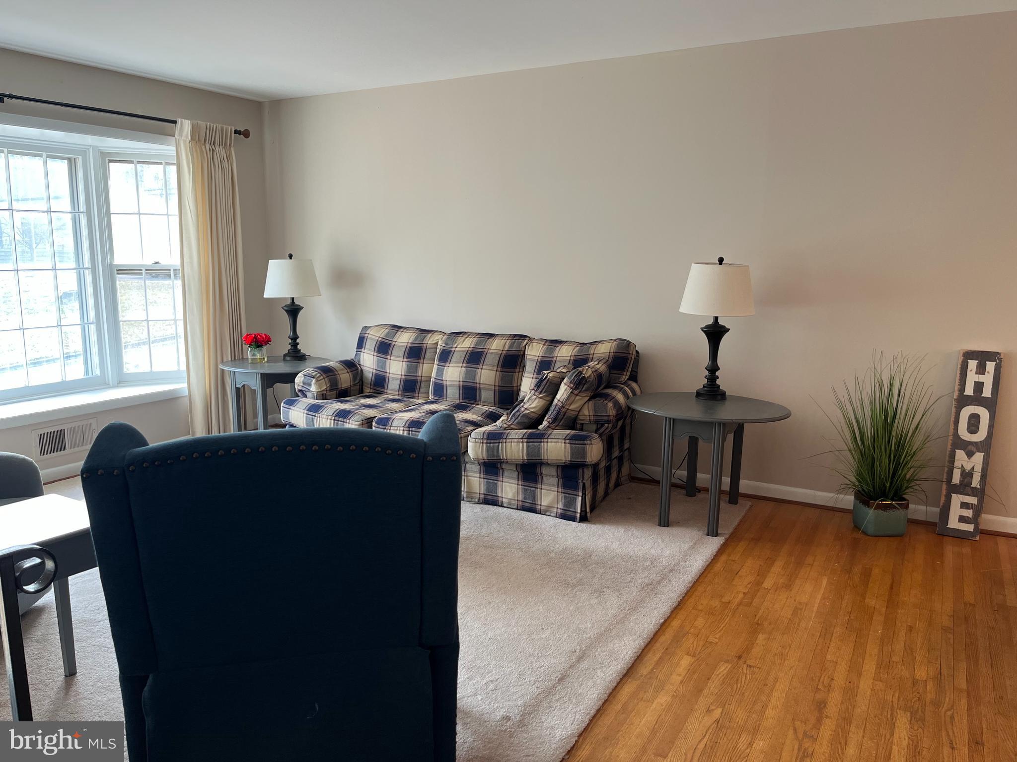 7018 Redmiles Road Laurel, MD 20707 - Photo 8 of 39 a living room with furniture and wooden floor