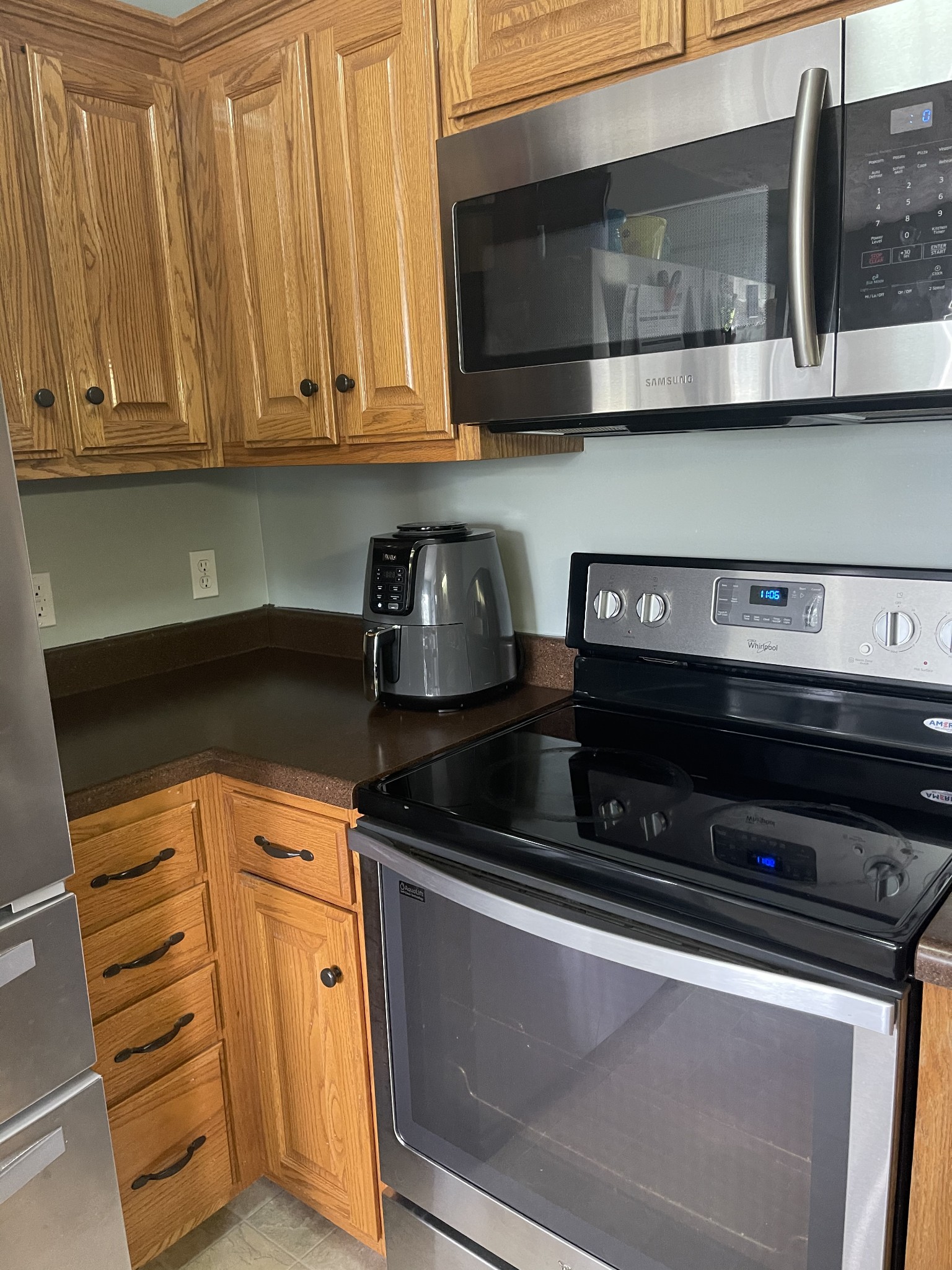72 Ferrells Loop Road Manchester, TN 37355 - Photo 4 of 11 a kitchen with stainless steel appliances granite countertop white cabinets and a stove top oven