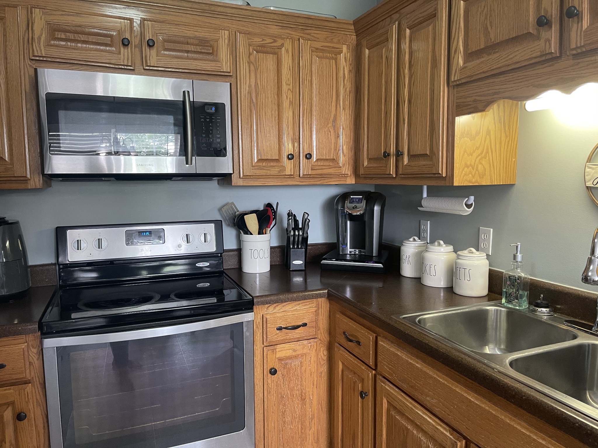 72 Ferrells Loop Road Manchester, TN 37355 - Photo 5 of 11 a kitchen with stainless steel appliances granite countertop a sink a stove and cabinets
