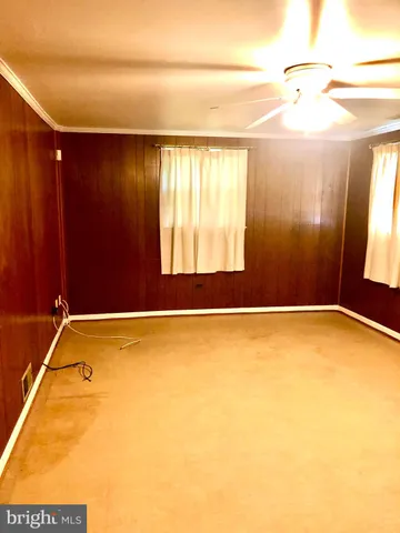 a bathroom with a tub and window