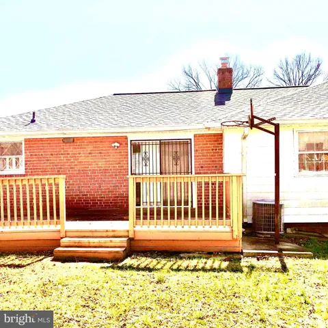 a view of a porch with a bench