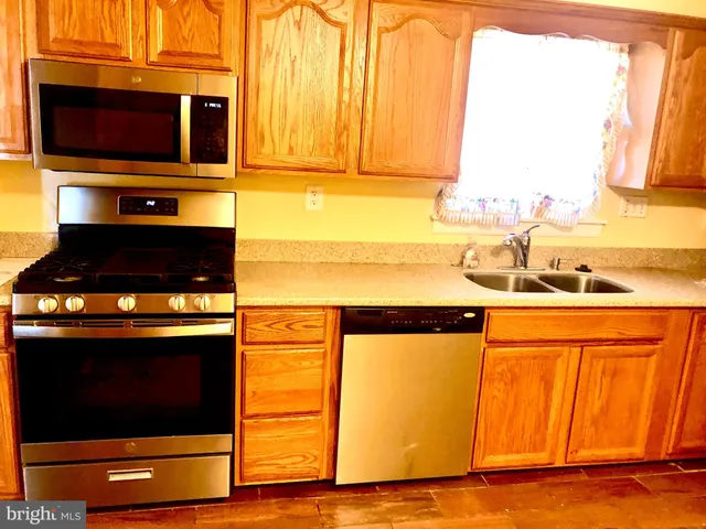 a kitchen with a stove and a microwave