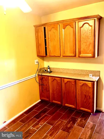 a view of a room with wooden floor and chair