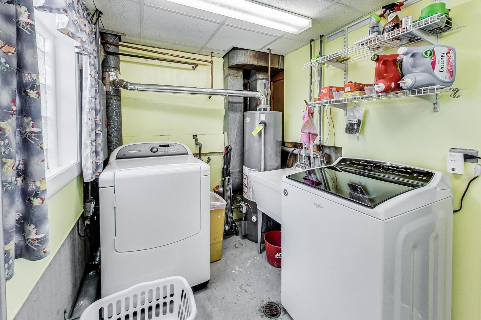 10729 Rutherford Avenue Worth, IL 60482 - Photo 17 of 22 a utility room with dryer and washer