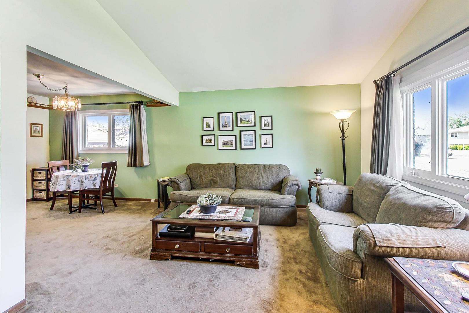 10729 Rutherford Avenue Worth, IL 60482 - Photo 4 of 22 a living room with furniture and a window