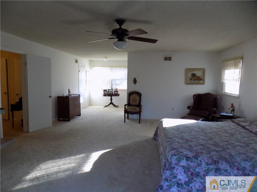 28 Taylor Road Princeton, NJ 08540 - Photo 12 of 24 a living room with furniture and a ceiling fan