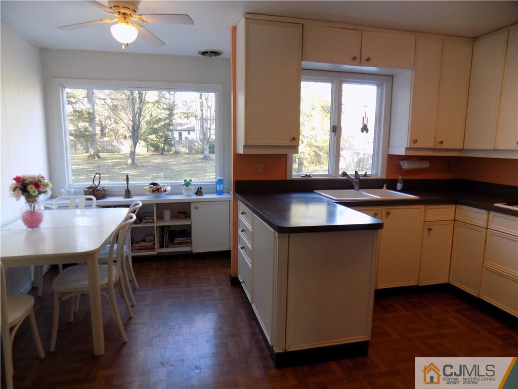 28 Taylor Road Princeton, NJ 08540 - Photo 3 of 24 a kitchen with a sink stove and cabinets