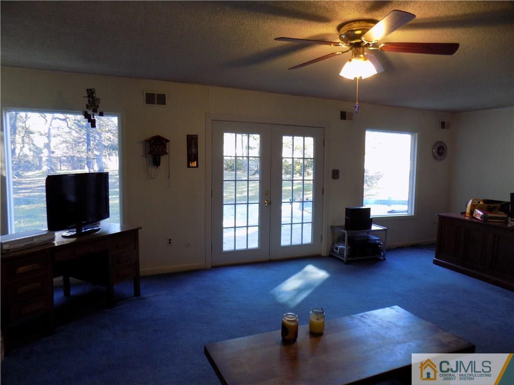 28 Taylor Road Princeton, NJ 08540 - Photo 21 of 24 a living room with furniture and a flat screen tv