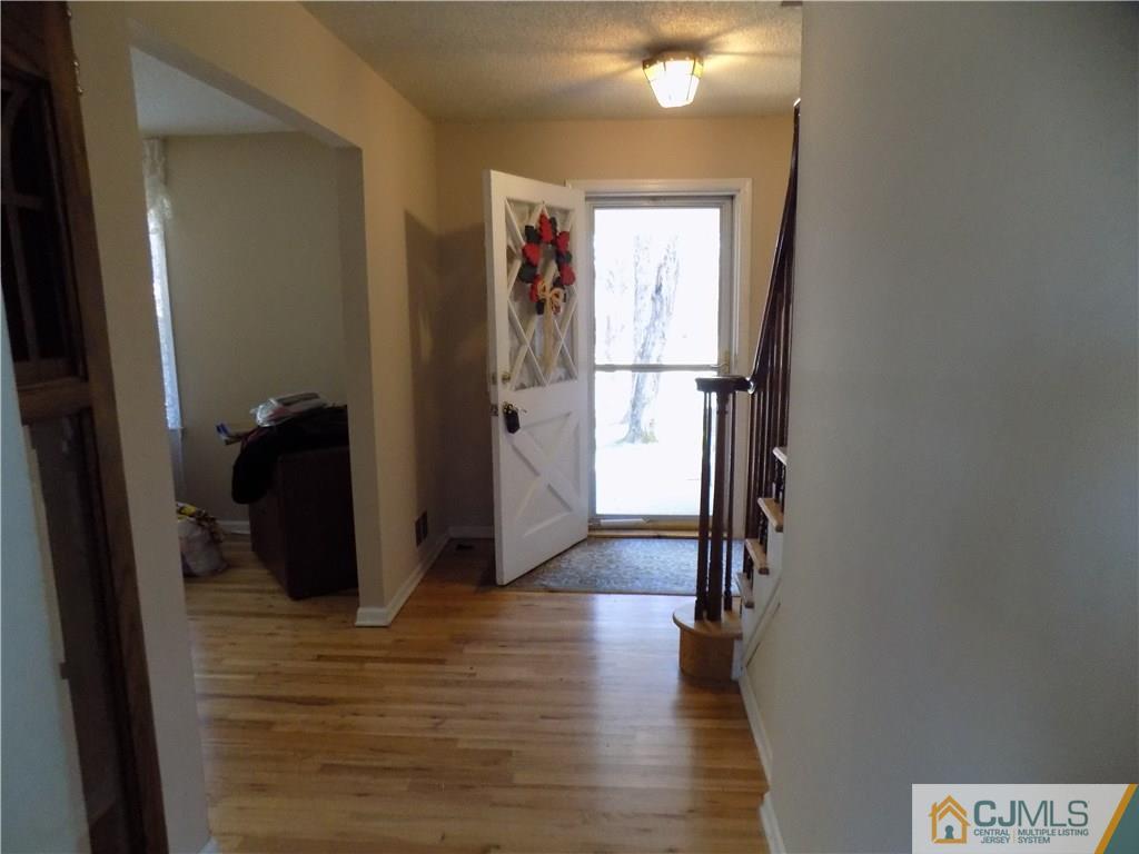 28 Taylor Road Princeton, NJ 08540 - Photo 22 of 24 a view of a hallway with wooden floor and closet