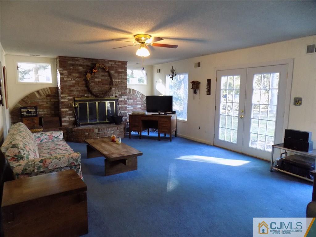 28 Taylor Road Princeton, NJ 08540 - Photo 4 of 24 a living room with furniture and a flat screen tv
