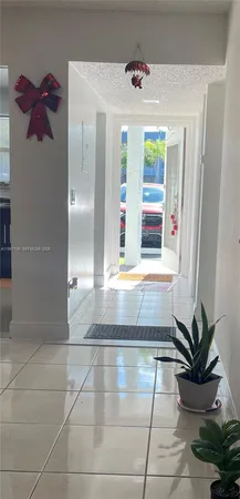 a view of a hallway with a window