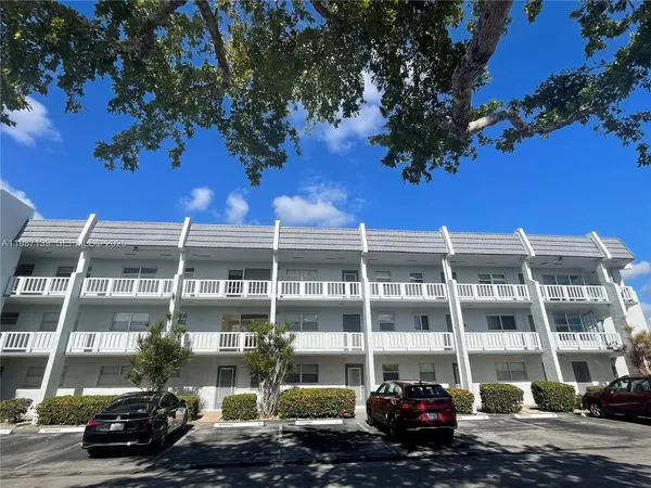 a front view of a building with street view