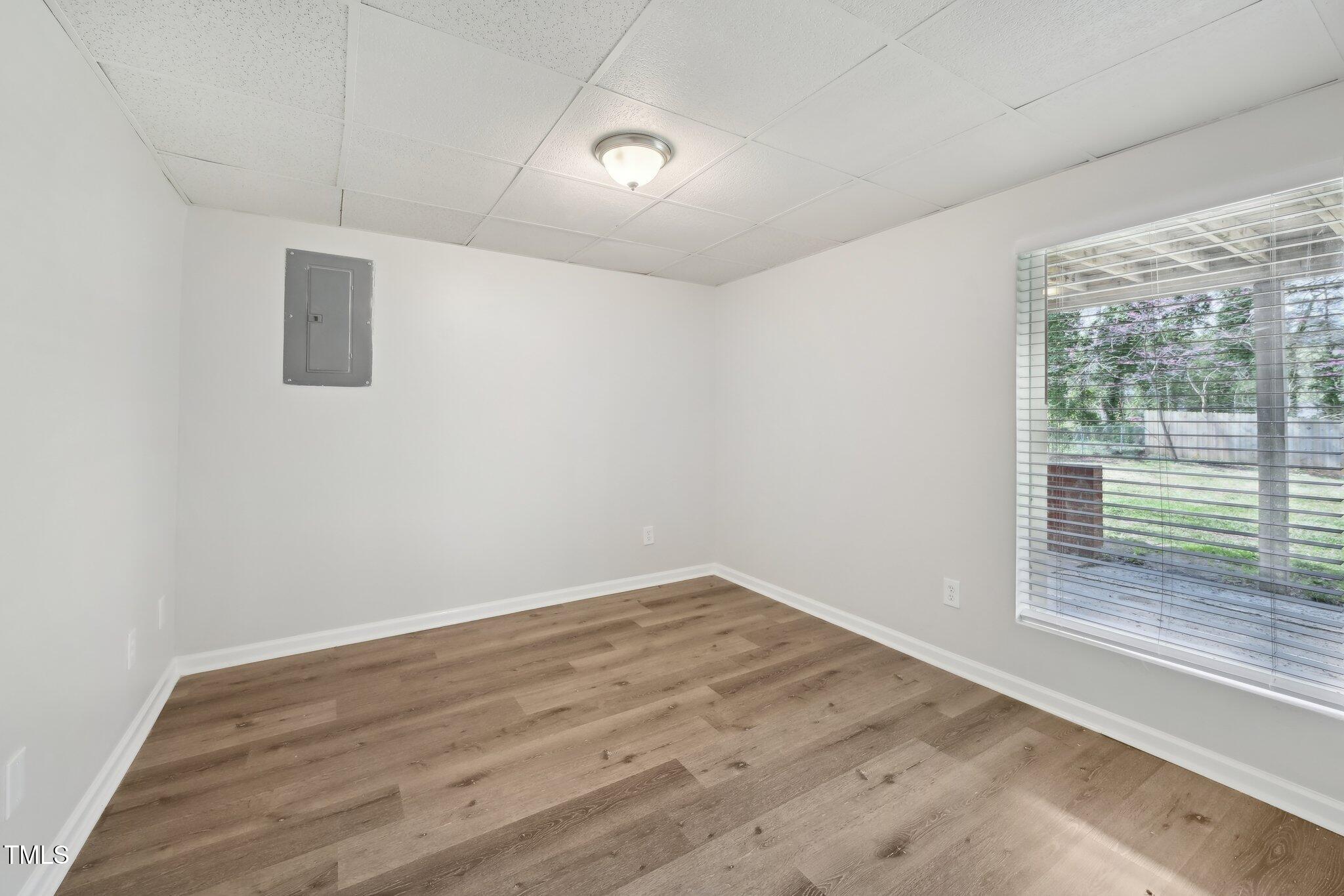 5218 Revere Road Durham, NC 27713 - Photo 27 of 46 wooden floor in an empty room with a window