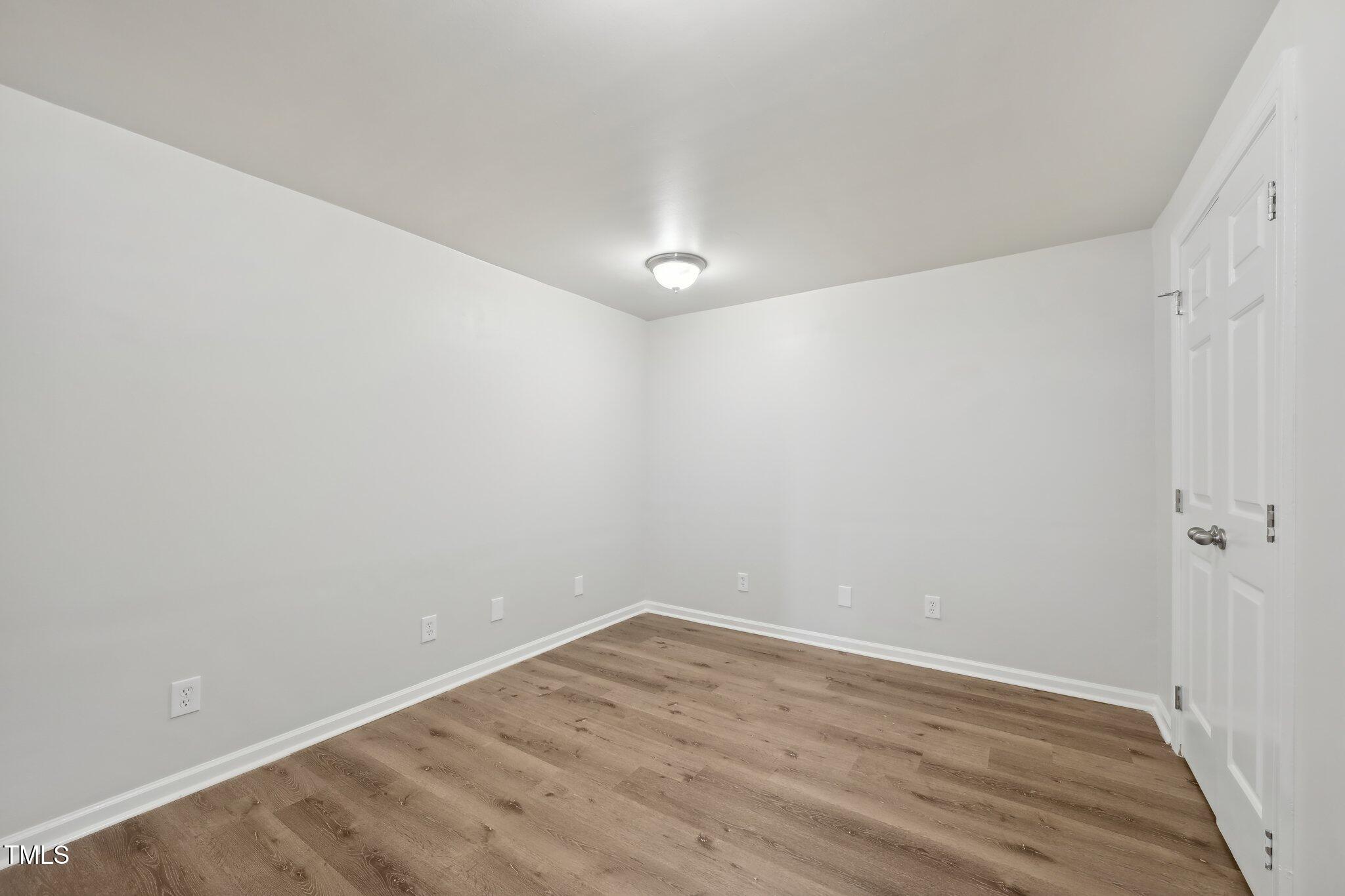 5218 Revere Road Durham, NC 27713 - Photo 29 of 46 a view of a room with wooden floor