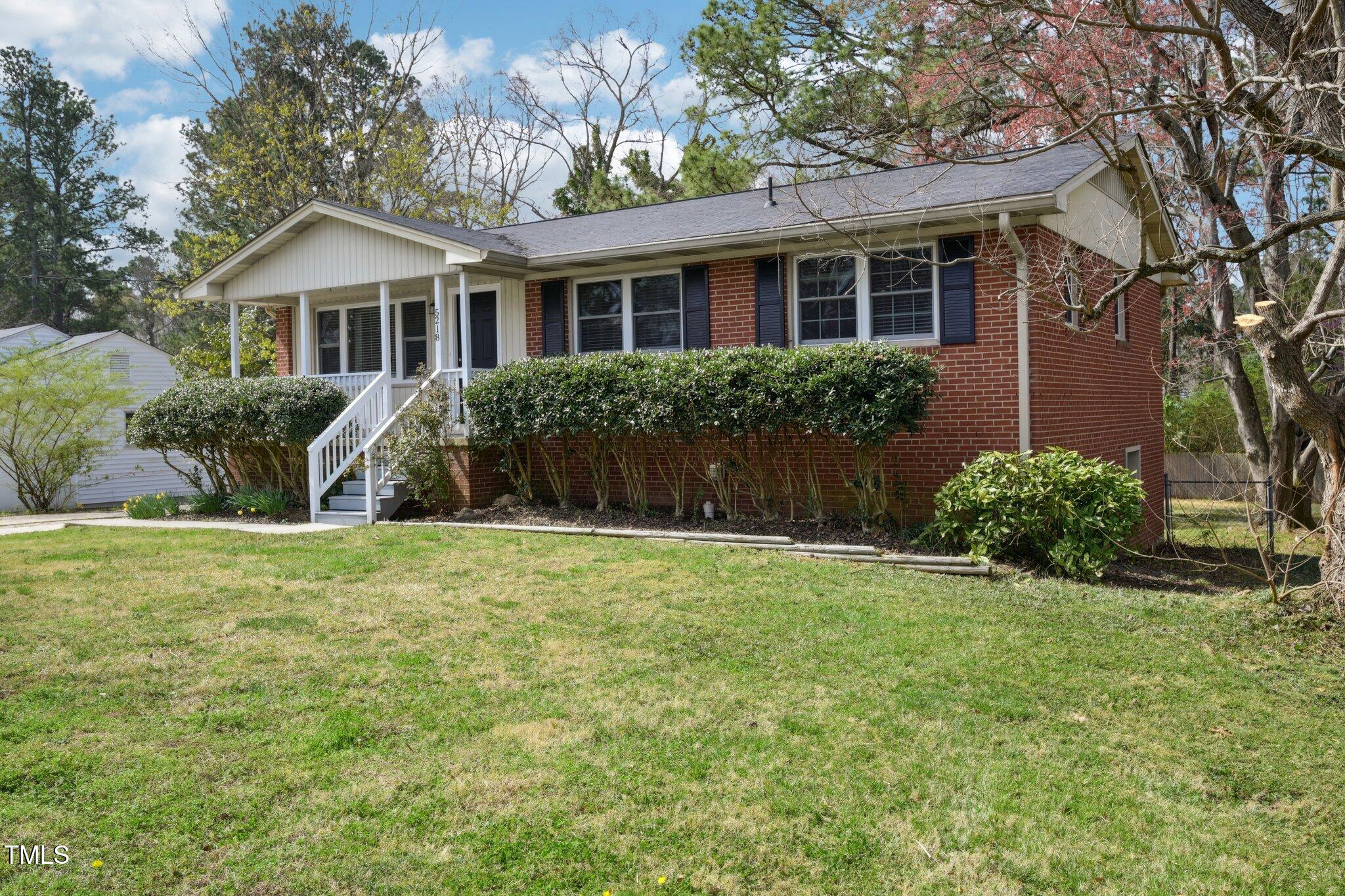 5218 Revere Road Durham, NC 27713 - Photo 3 of 46 a front view of house with yard and green space