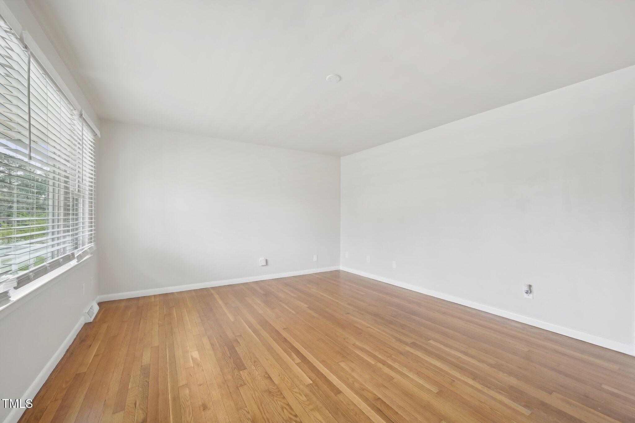 5218 Revere Road Durham, NC 27713 - Photo 5 of 46 wooden floor in a empty room