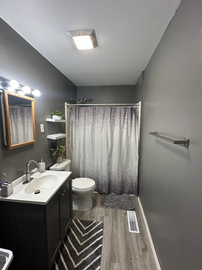623 4th Avenue Dixon, IL 61021 - Photo 11 of 19 a bathroom with a sink toilet and shower