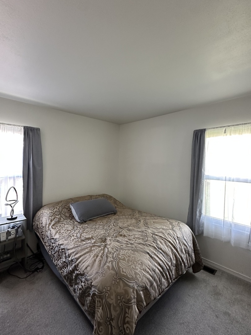 623 4th Avenue Dixon, IL 61021 - Photo 9 of 19 a bedroom with a bed and window