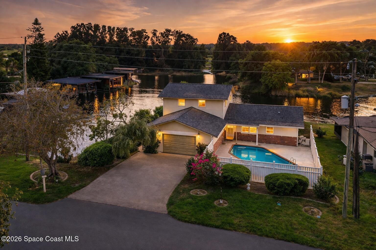 aerial view of a house with a yard