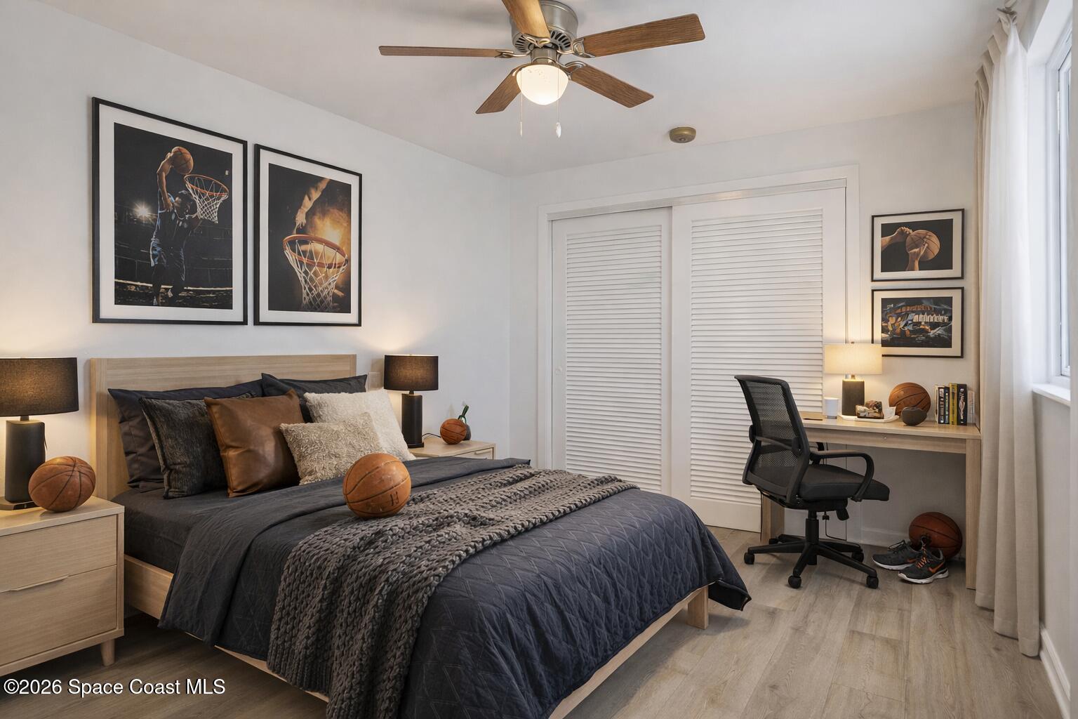 850 Cardinal Road Cocoa, FL 32926 - Photo 11 of 41 a bedroom with a bed and wooden floor