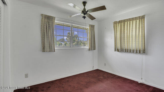 850 Cardinal Road Cocoa, FL 32926 - Photo 14 of 41 an empty room with windows and fan
