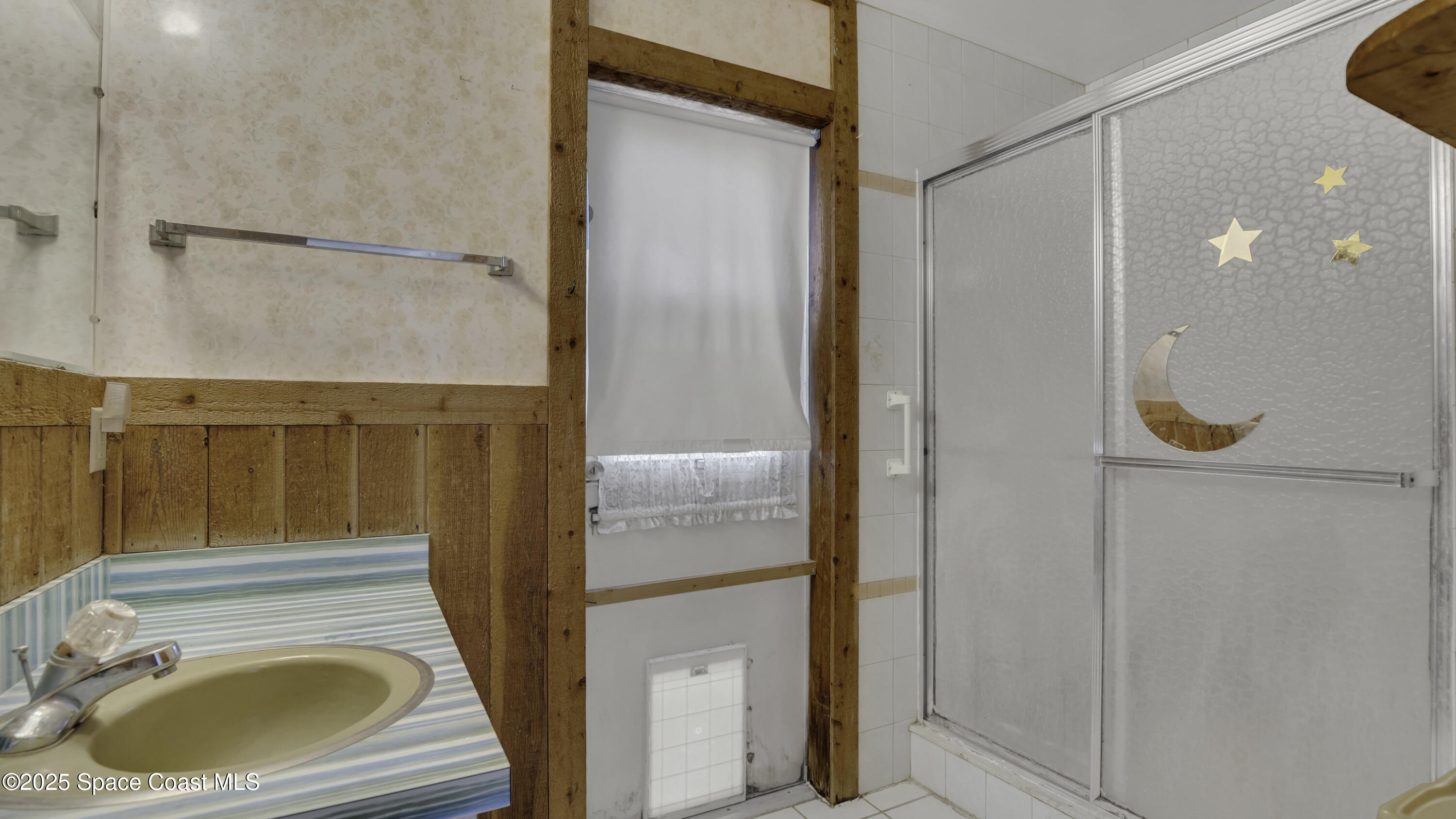 850 Cardinal Road Cocoa, FL 32926 - Photo 16 of 41 a bathroom with a sink and a mirror