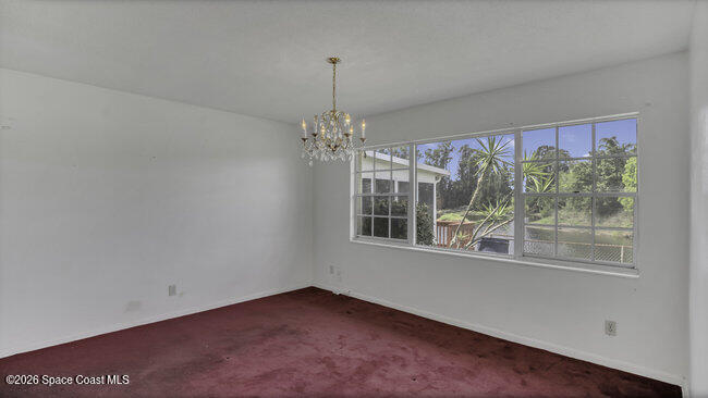 850 Cardinal Road Cocoa, FL 32926 - Photo 18 of 41 a view of an empty room with a window