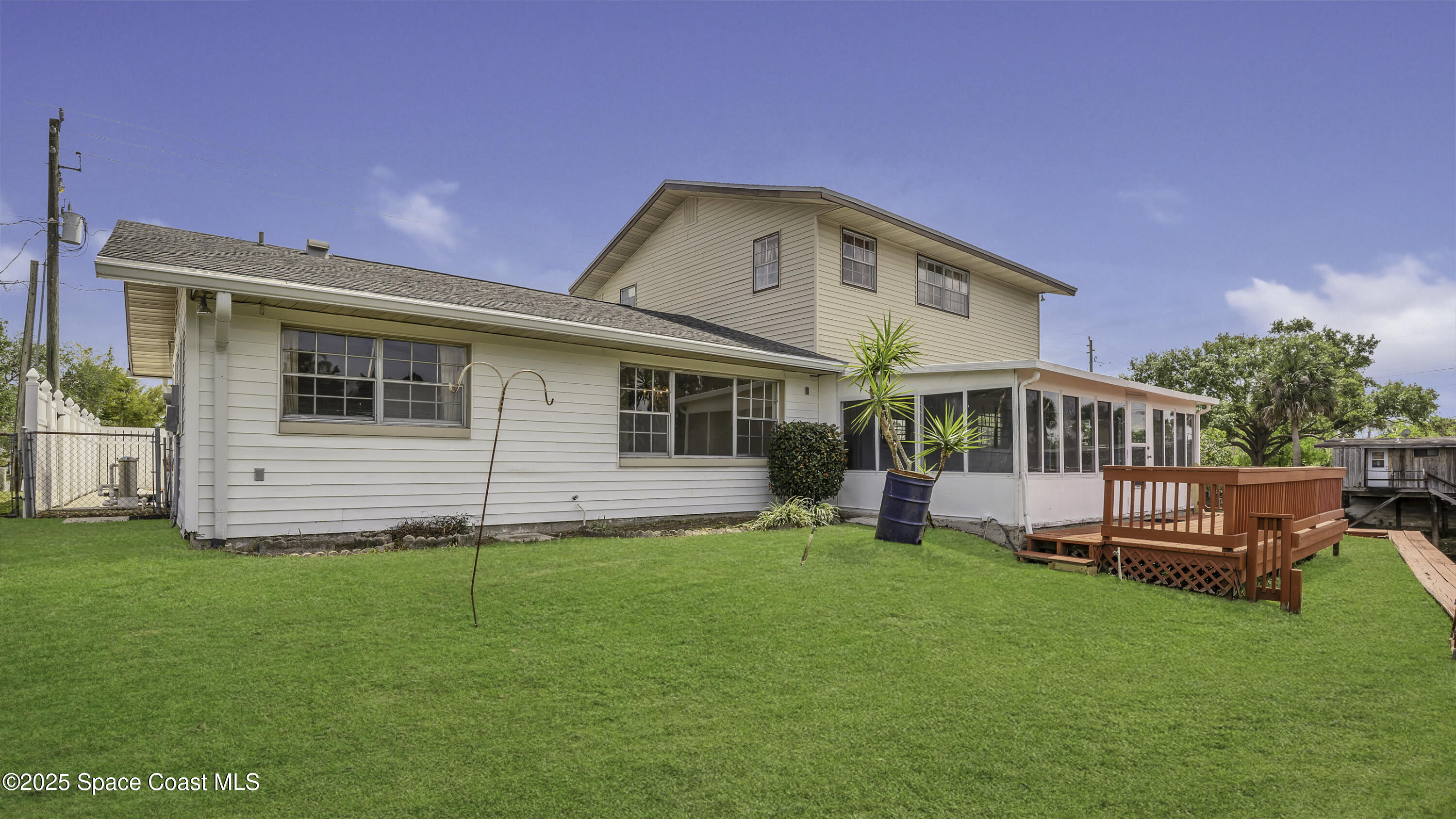 850 Cardinal Road Cocoa, FL 32926 - Photo 26 of 41 a front view of house with yard and outdoor seating