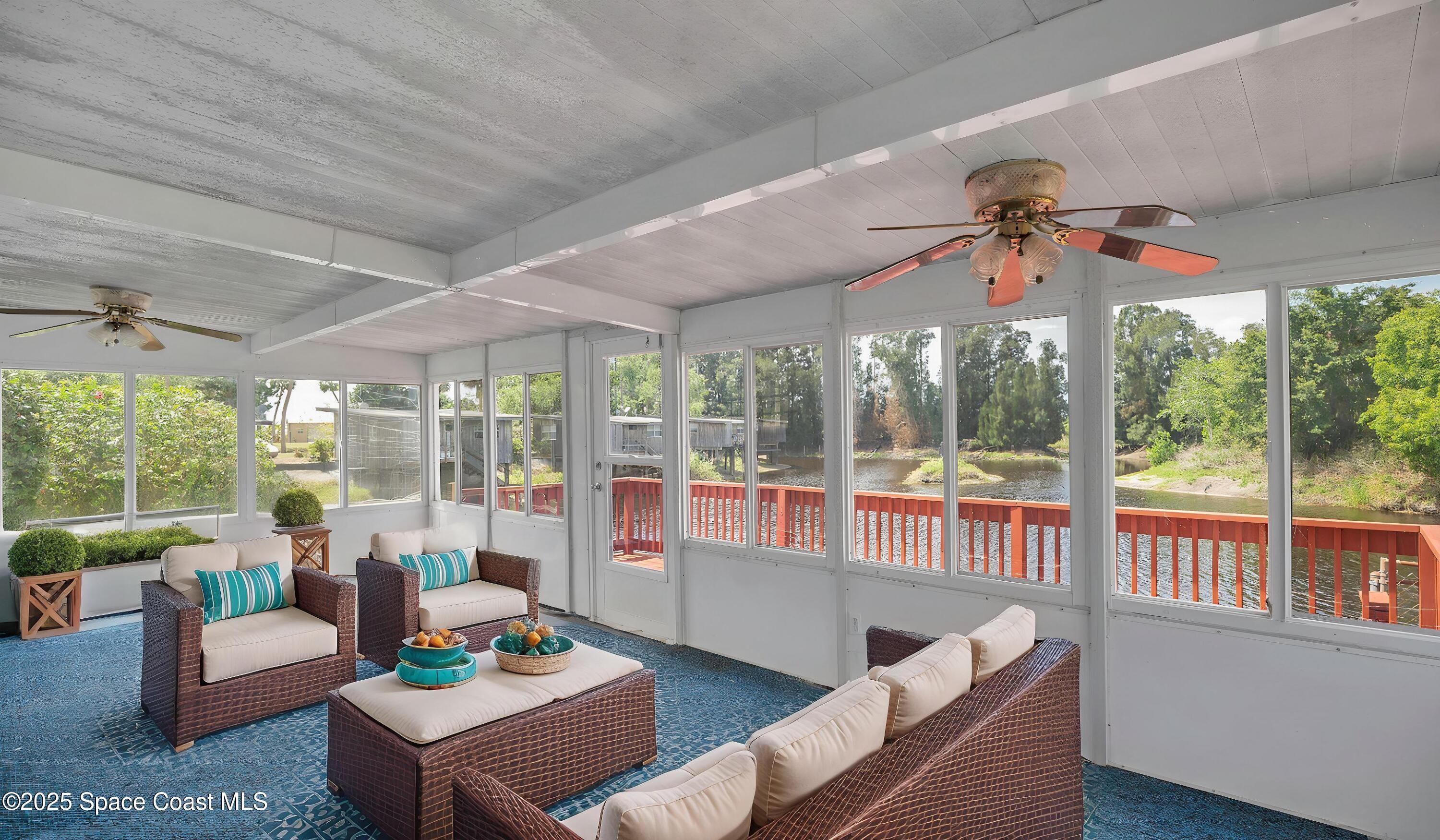 850 Cardinal Road Cocoa, FL 32926 - Photo 27 of 41 a living room with furniture and a large window