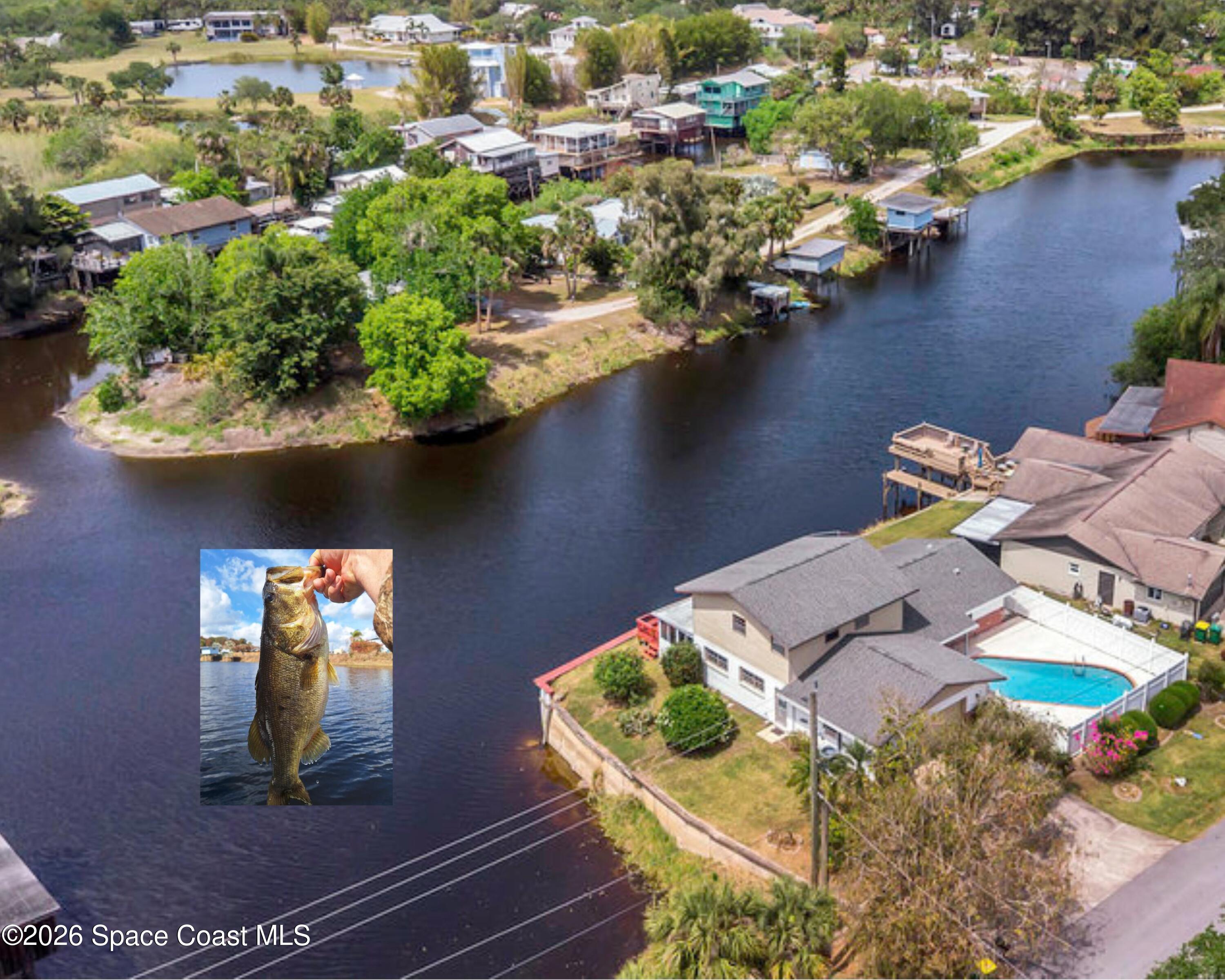 850 Cardinal Road Cocoa, FL 32926 - Photo 30 of 41 an aerial view of a house with a lake view