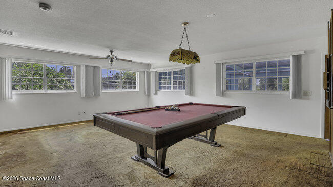850 Cardinal Road Cocoa, FL 32926 - Photo 3 of 41 a room with pool table and windows