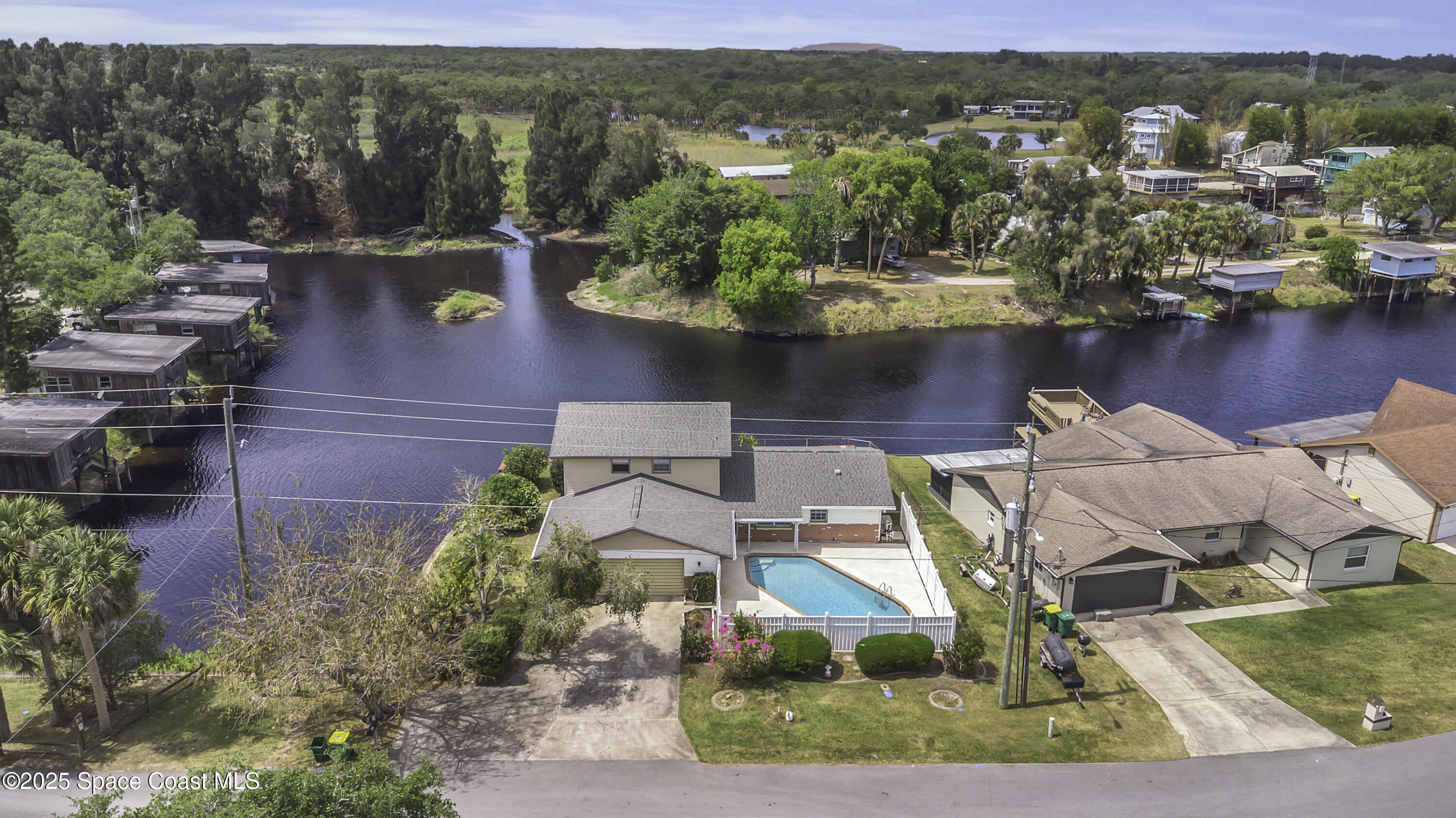 850 Cardinal Road Cocoa, FL 32926 - Photo 33 of 41 an aerial view of residential houses with outdoor space and lake view