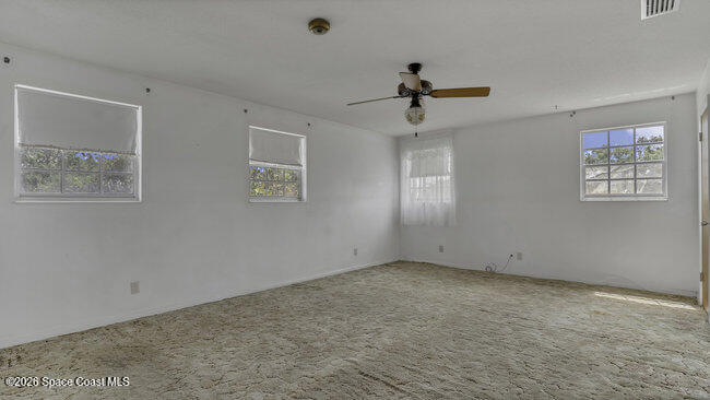 850 Cardinal Road Cocoa, FL 32926 - Photo 8 of 41 a view of room with window and ceiling fan