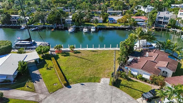 an aerial view of a house with a lake view