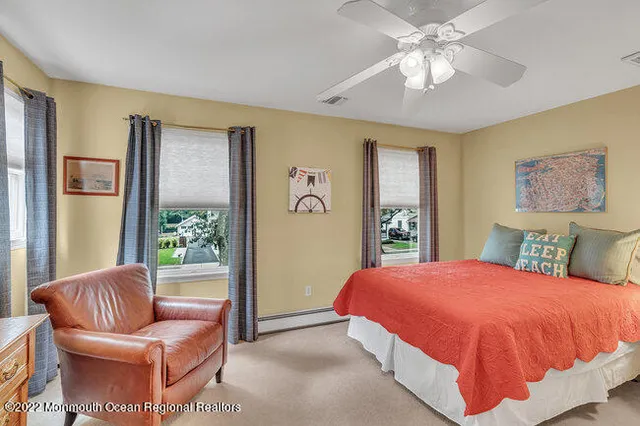 a bedroom with a large bed and a couch