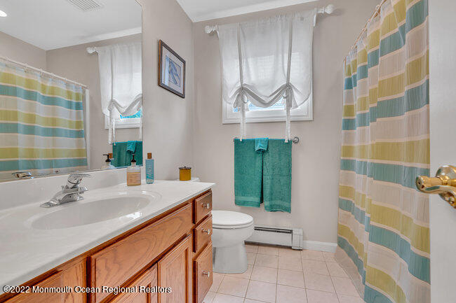 52 Morris Avenue Manasquan, NJ 08736 - Photo 15 of 20 a bathroom with a sink a toilet and shower