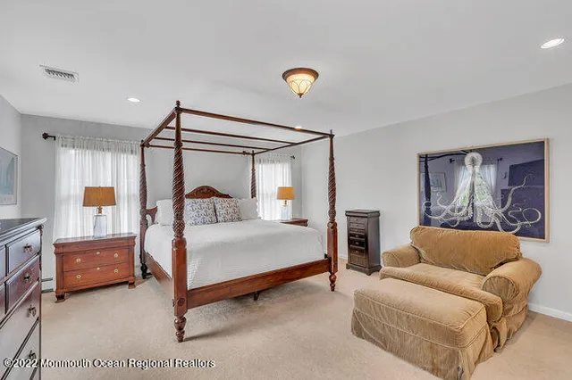 a bedroom with bed and window